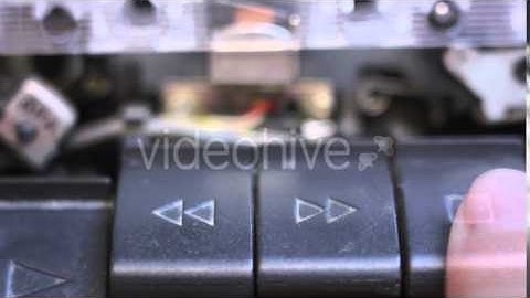 Pushing Buttons Stop Play Rewind on Tape Recorder