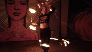 Madison Orange performing with two fire hoops