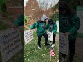 See York College students placing flags around campus for Veterans Day 2025