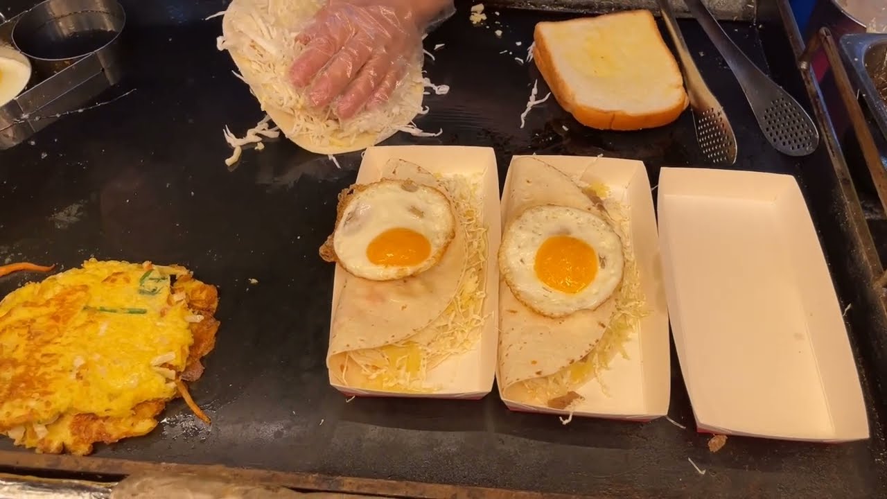 Pancakes with cabbage, eggs and bacon Kyabetsuyaki Japanese Street