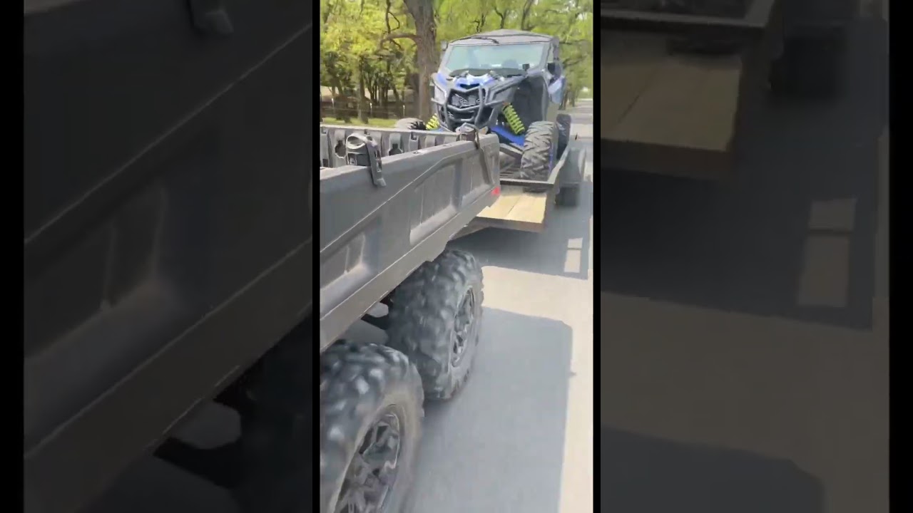 Can-Am Defender 6x6 towing a Maverick X3 Turbo RR