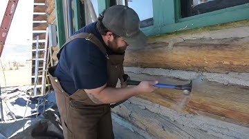 Removing OLD Concrete Chink is tuff work even for Log Masters.