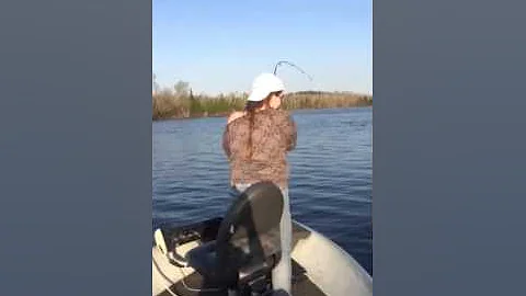Jen catching a fish