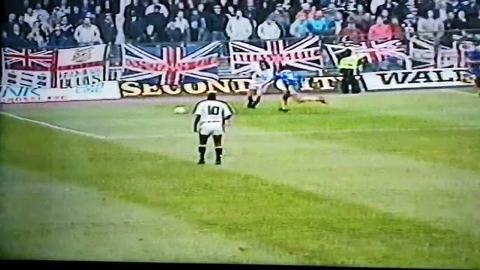 Soccer - Nationwide League Division Two - Swansea City v Millwall. A  policeman in a riot helmet grabs