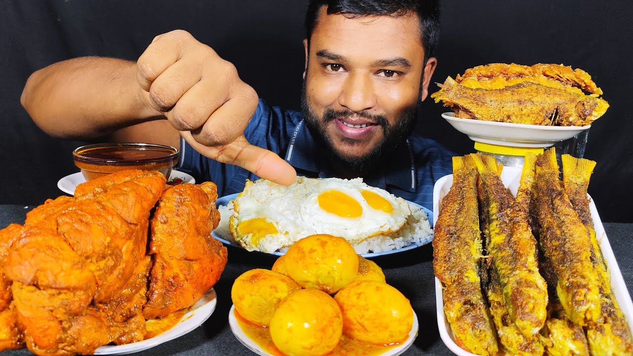 Spicy full chicken curry, egg curry , full fish fry  and egg fry with rice eating show