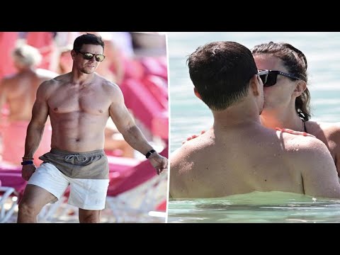 Shirtless Mark Wahlberg kisses wife Rhea Durham in the ocean on Barbados vacation