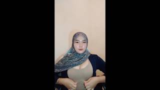 Miss hijab shows off her cleavage while dancing lightly
