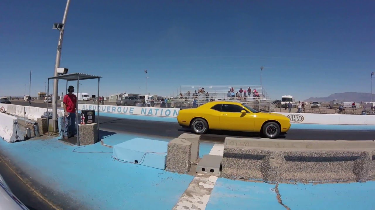 Tesla P90D Ludicrous vs Dodge Challenger on drag radials