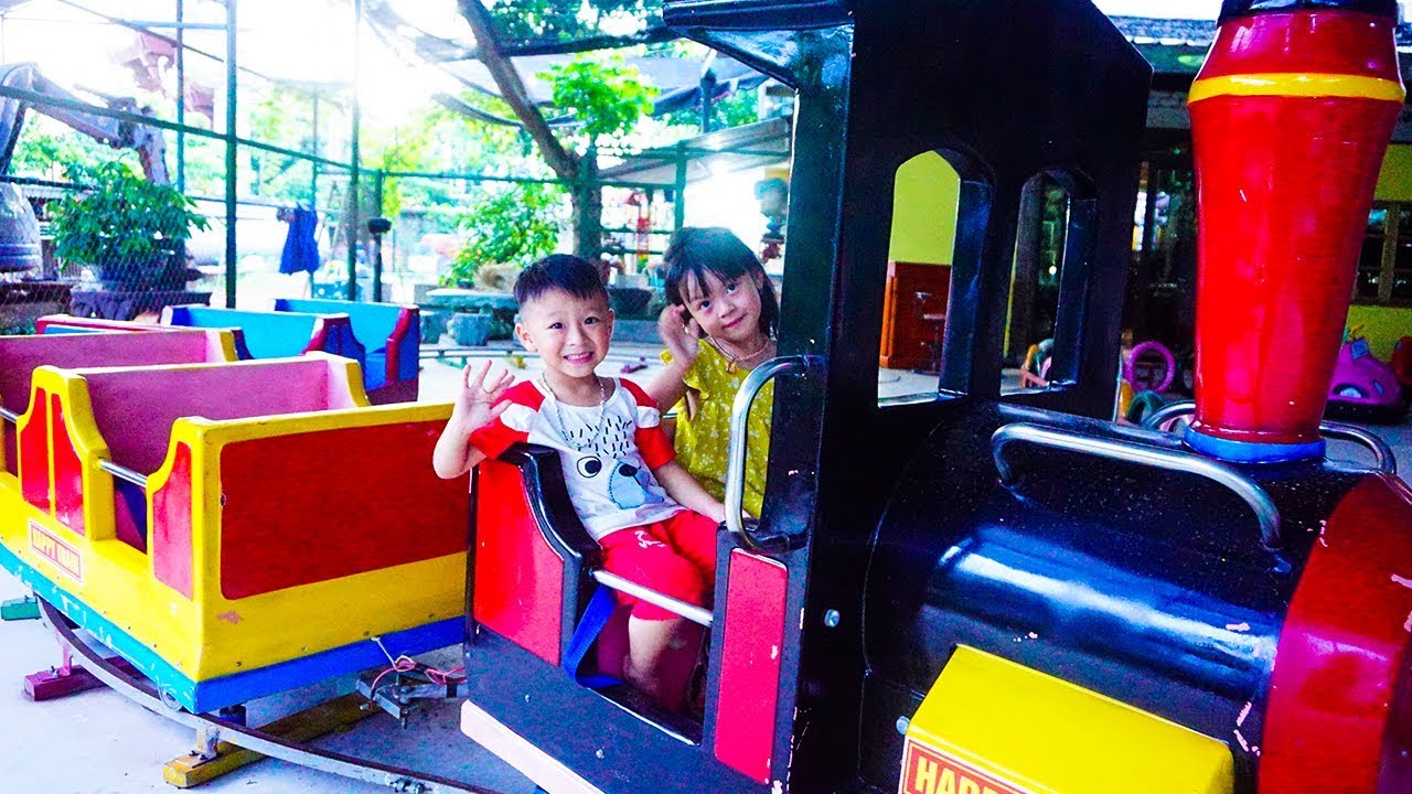 Kids Play Indoor Playground with Train Rides Family go to Children's