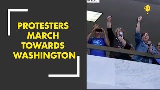Thousands of protesters march towards Washington as Kavanaugh vote nears