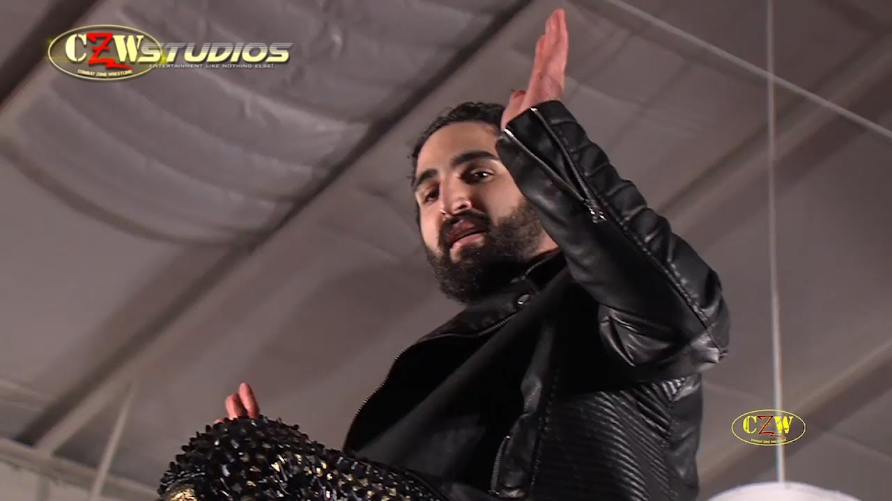 Gangone sends Joe Gacy off the top of the cage | CZWstudios.com