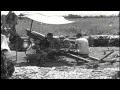 US soldiers inspect weapons and Chinese soldiers fire 75mm pack artillery at Myit...HD Stock Footage