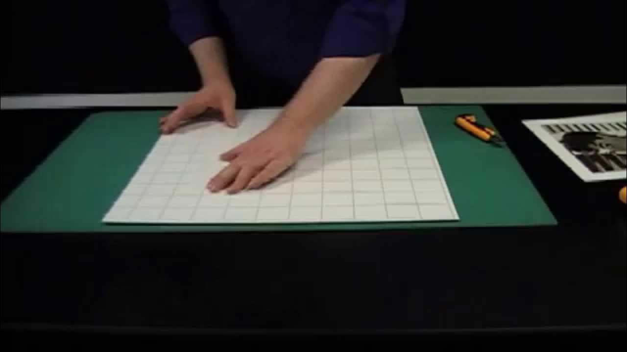 Mounting a photo or print by hand onto self adhesive board 