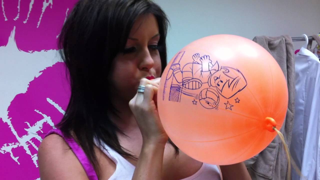 Chat Girl TV Talia blows up an Orange Balloon.