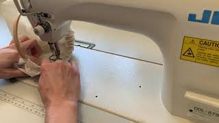 Sewing a Casing Around a Rigid Structure