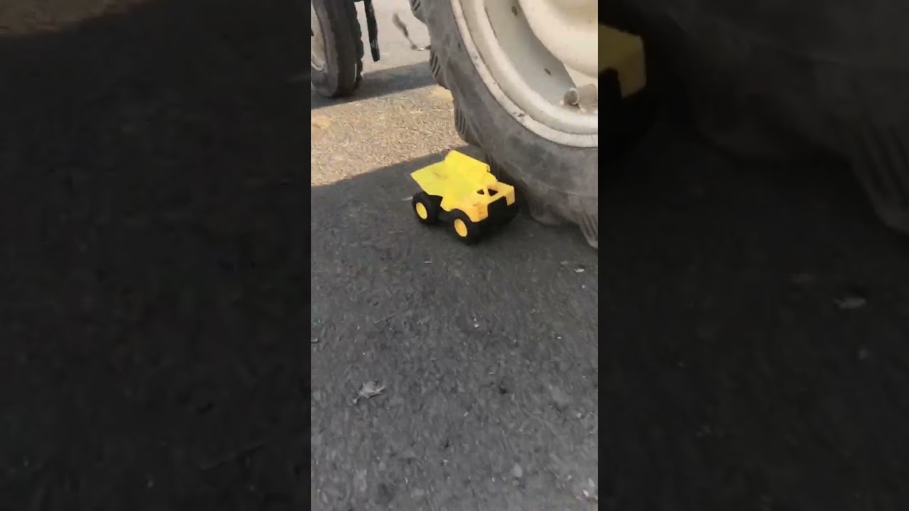 Dumper truck toy damage by real tractor 