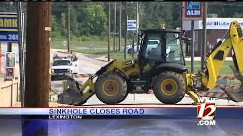 Road Crew Repairs Sink Hole