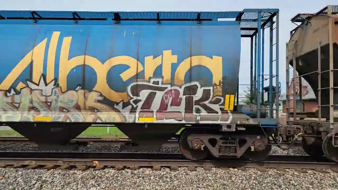 CN 5754, 2343 Westbound train with Potash, Canada, Alberta, Saskatchewan hoppers, KCS auto racks