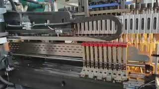 Variable pitch, high speed, high output blow molding machine.