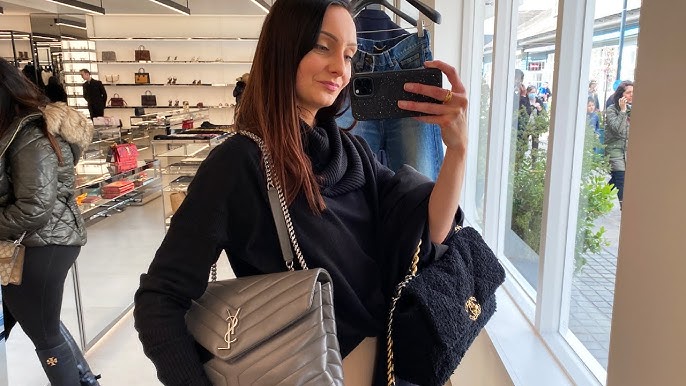 Woman with Louis Vuitton bag and Chanel scarf before Fendi fashion