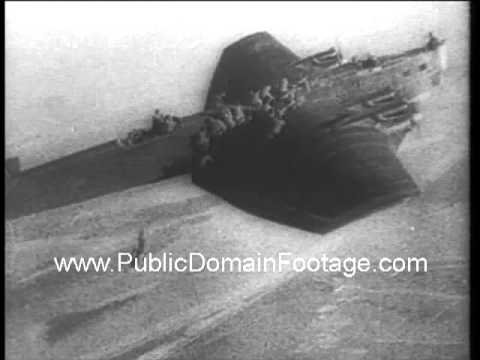 1938 Russian paratroopers jump from wings of plane newsreel archival footage