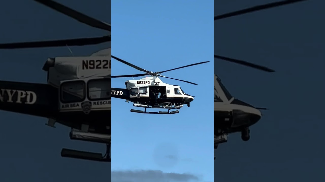 NYPD helicopter flying over Rockaway beach 