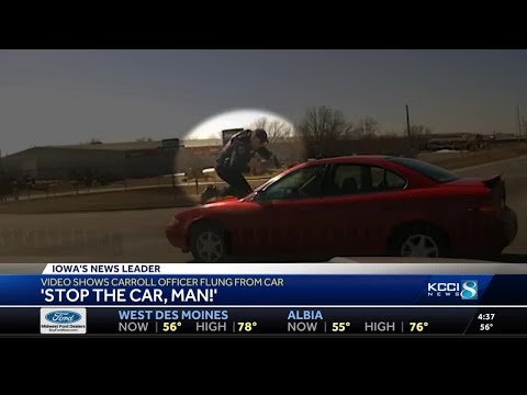 Officer clings to roof of suspect's car in new video of a Carroll car chase