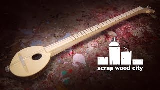 Making a 2 string musical instrument out of coconut and wood