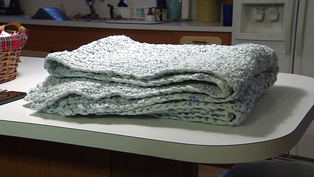 Woman uses recycled bags to crochet mats for homeless veterans YouTube