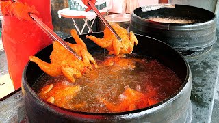 Deep-fried whole chicken in a huge pot - korean street food