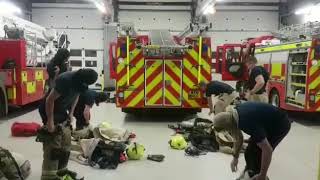World record firefighters dressing in full kit and breathing aparatus