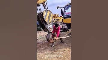 Securing a crane hook: a construction worker