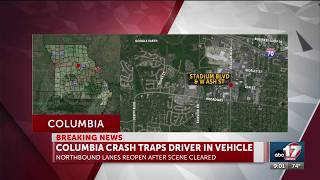 One taken to hospital after Columbia crash traps them in vehicle