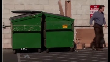 man throws computer in the trash and then picks it up