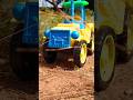 dumper trucks loading tractor