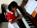 Auld Lang Syne on Piano - 8 year old playing by the Ear.MPG