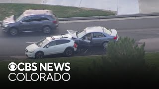 Aurora police say hit-and-run victim chases suspect driver after crash, holds him until officers arr