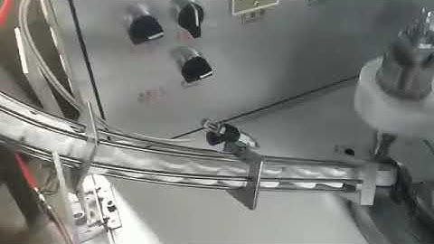 Automatic beverage bottle cap folding and cutting machine