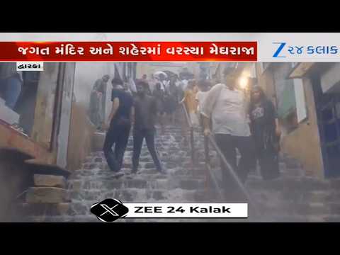 Water gushes over the steps of Moksh Dwar of Dwarkadhish temple following heavy rainfall in Dwarka