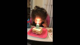 Girl accidentally burns the front of her hair from number 3 birthday candle on cake