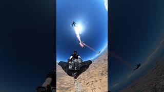 Skydiver and Wingsuiter Perform “Wingsuit Rodeo” with Smoke