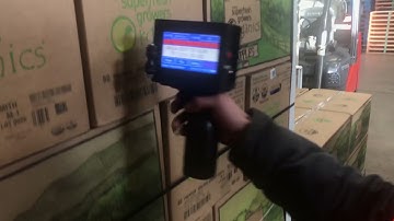 SNEED-JET Titan T6 Handheld Printer Coding Palletized Boxes in Warehouse