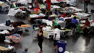 Houston evacuees head to longer-term shelters