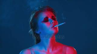 Beautiful sexy lady Smoking cigarette at neon retro party drunk or high — Stock Video & Footage