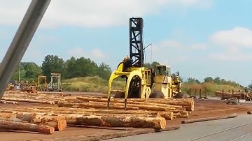 letourneau log stacker spreading huge load of logs