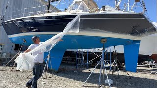 Prepping and painting a oyster white Bootstripe on the Erickson 38