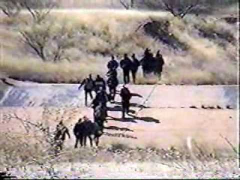 This video shows various apprehensions of illegal aliens entering the United States in Cochise County, AZ, 2003. (Segment 4 of 4). Apprehensions of illegals were made by US Border Patrol agents, or by US Citizens, who then called the Border Patrol to detail and process the illegal aliens (sometimes called illegal immigrants, but they are by definition immigrants). With illegal aliens entering the United States at the rate of up to 10000 per day, we now have 20 to 38 million illegal aliens present. www.desertinvasion.us This video shows both day and night time apprehensions and illustrates how difficult it is to apprehend the vast majority of illegal aliens crossing our border, without adequate numbers of Border Patrol Agents, funding, and a secure border fence. The US Border Patrol is overwhelmed by the invasion of illegal aliens. They do not have adequate staffing, equipment or funding to do an adequate job of securing our border, and our President is pushing for elimination of our borders under the guise of a Security Prosperity Partnership, merger with Canada and Mexico, and an eventual North American Union. Yet the agents on the ground are dedicated to doing their job and making every effort to protect America against invasion.