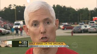 Flap over cheerleaders' Bible verses on banners