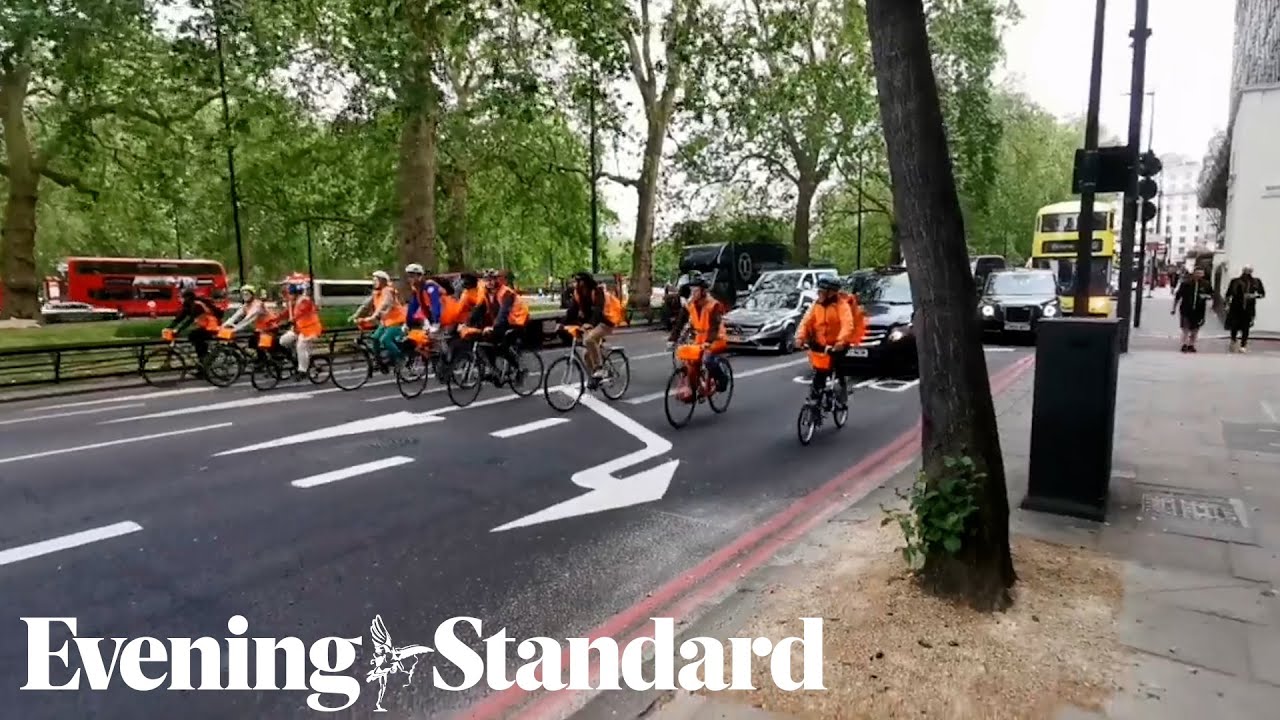 Just Stop Oil protestors slow cycle blocking traffic on Park Lane