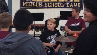 12 year old boy plays drums like a maniac after band concert